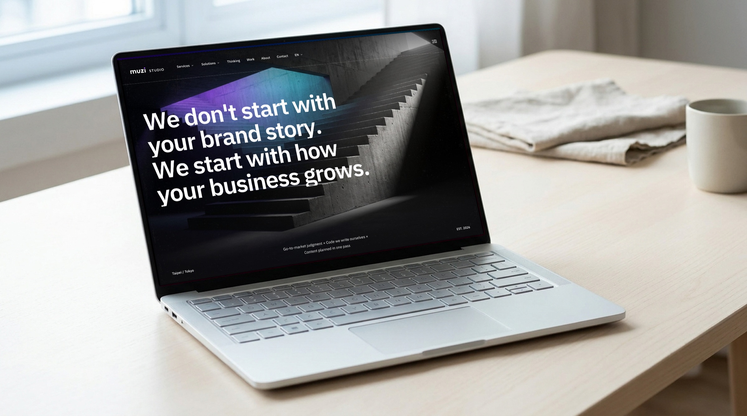 Digital: muzi.tw homepage on a laptop