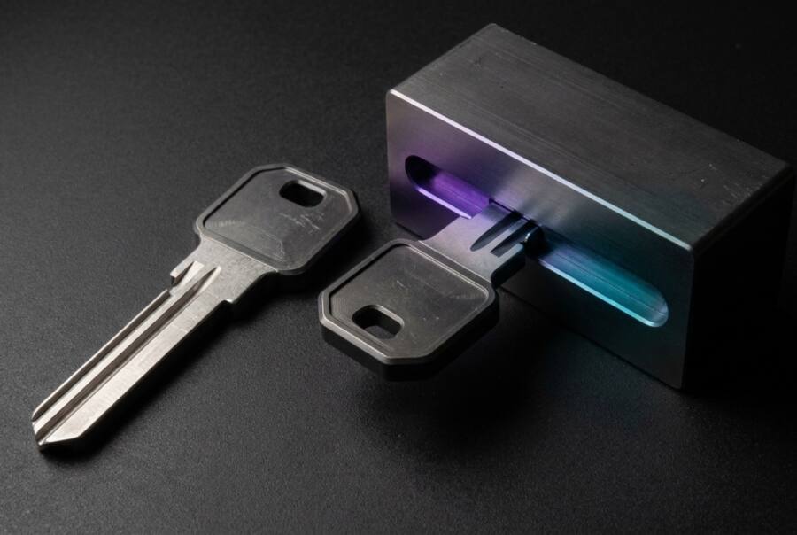 A metal key and a similarly shaped black key